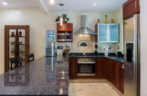 Playacar Fase I Condo | Second Floor Unit with views of the gardens and pool at Paseo del Sol by BRIC