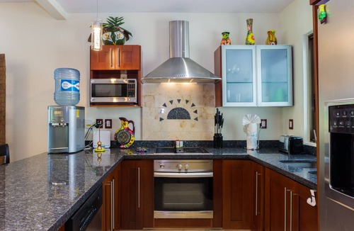Playacar Fase I Condo | Second Floor Unit with views of the gardens and pool at Paseo del Sol by BRIC