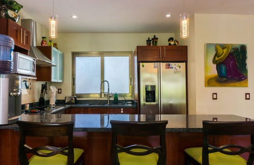 Playacar Fase I Condo | Second Floor Unit with views of the gardens and pool at Paseo del Sol by BRIC
