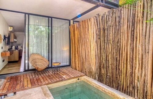 La Veleta Apartment | Serene, ground-floor getaway with private & shared pool, washer/dryer, & patio