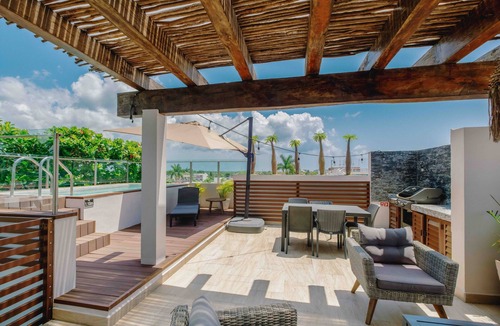 Colonos Cuzamil Apartment | Serviced 1-Bedroom Apartment · Rooftop BBQ + Pool · Bikes · Security