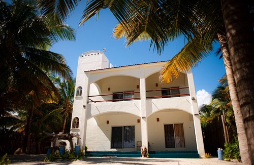 Majahual House | Spacious oceanfront home with palm trees, kayaks and spectacular views!