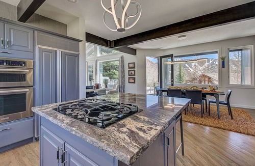 Deer Valley House | Spacious patio at secluded home in peaceful Deer Valley with private hot tub, BBQ grill