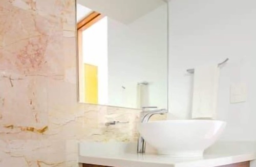 12th Street Apartment | Studio with AC Kitchen Pool Gym and Rooftop view