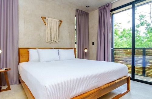 La Veleta Condo | Stylish Eco-Friendly Condo w/ Private Roof Lounge