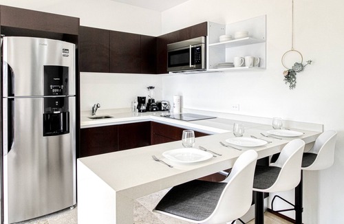 Tulum City Center Apartment | Tropical luxurious apartment with pools, rooftop views, & balcony - dog-friendly