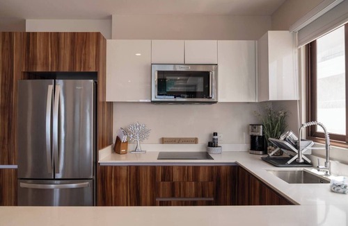 Centro - Supmza 001 Apartment | Wake up to turquoise waters at Isla Bliss 🌴 — a luxury 3-bedroom oceanfront condo just minutes from Isla Mujeres’ best dining and beaches. Enjoy a 90" Smart TV, stunning views, fast WiFi, and easy self-check-in for the perfect island escape. 🌊✨
