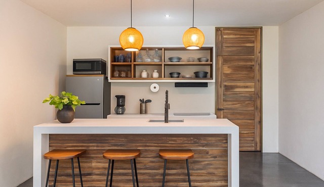 1-Bed Condo Kitchen Island Pool Views