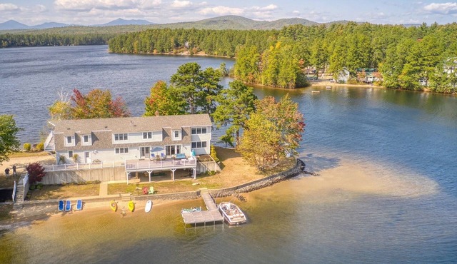 A four-season lakefront retreat on your own private peninsula in Ossipee