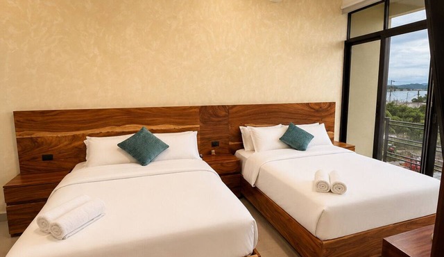 Boutique Suite | 2 Queen Beds | Lake & Flores Island View in San Benito