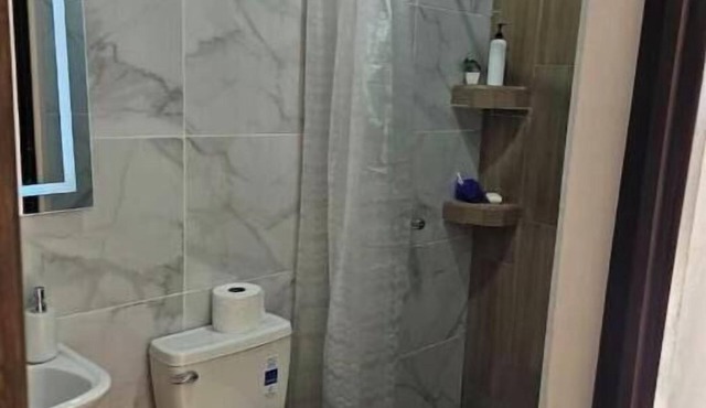 Comfortable Airport Front Apartment with Private Parking in Petén