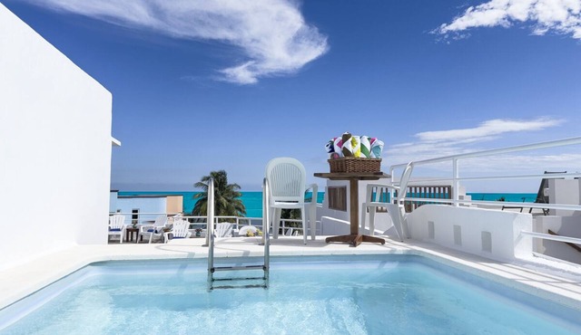 Five-bedroom ocean view home with private rooftop pool, elevator, and WIFI