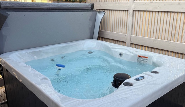 Modern 2-bedroom home with 2 full bathrooms and hot tub! in Dubuque