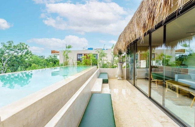 Stunning Tulum Condo: Rooftop Pool & Modern Design