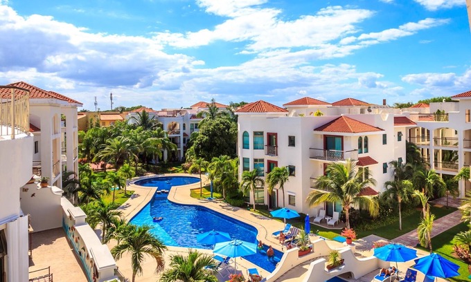 Playacar Condo | Beautiful Garden floor condo with pool views in Paseo del Sol by BRIC