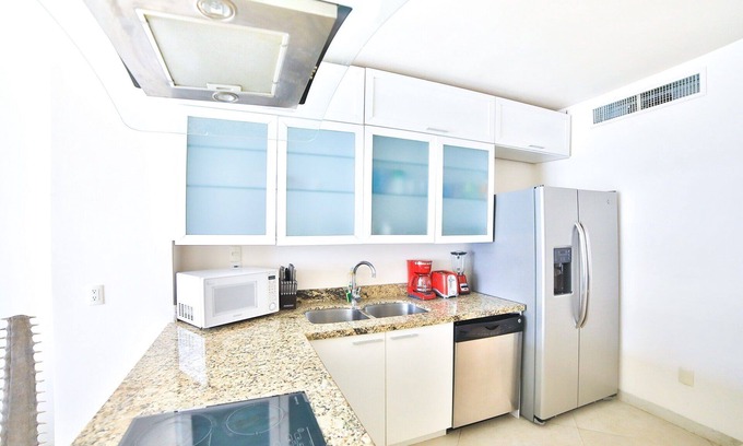 Gonzalo Guerrero Condo | Modern condo with patio and balcony overlooking 5th Ave. 4 minute walk to beach!