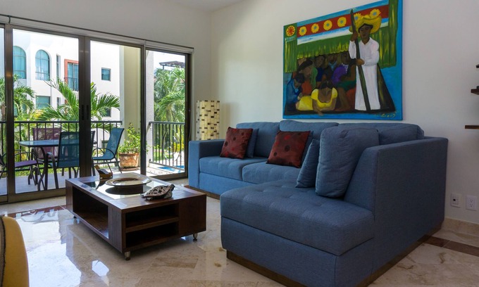 Playacar Fase I Condo | Second Floor Unit with views of the gardens and pool at Paseo del Sol by BRIC